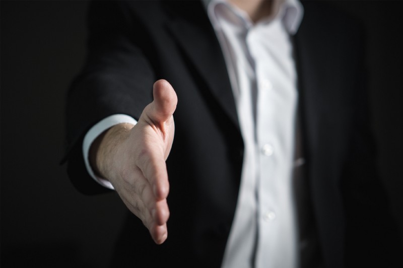 Businessman extending hand for handshake