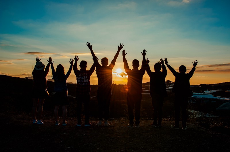 Group of people against the sunset