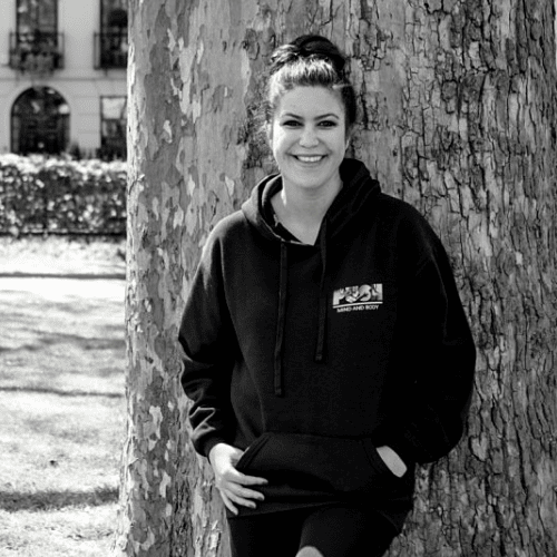 Woman Smiling Against Tree