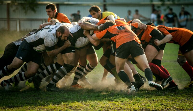 High performing teams benefit business. Photo of rugby team olga guryanova unsplash